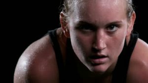 stock-footage-a-female-athlete-breathes-heavy-and-sweats-after-an-intense-exercise-while-looking-into-the-camera