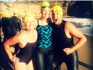 Lyndsay DeFilippo, physical therapist at Rausch PT, (center) after her first open water swim.