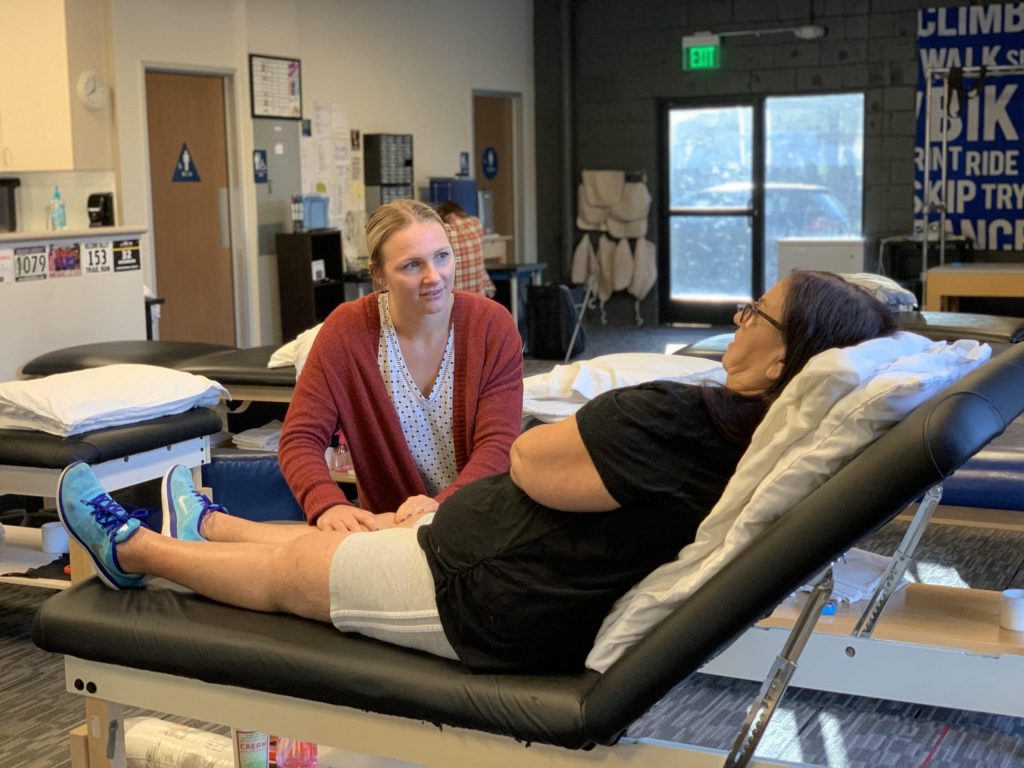 Rausch PT therapist working one-on-one with a patient during a treatment session
